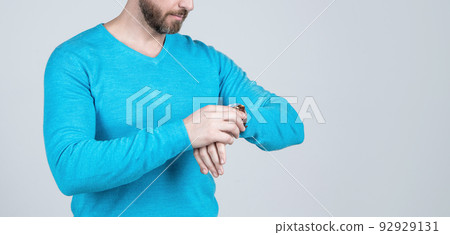 cropped guy checking time. guy with wristwatch. copy space. cropped man in casual wear accessory. 92929131