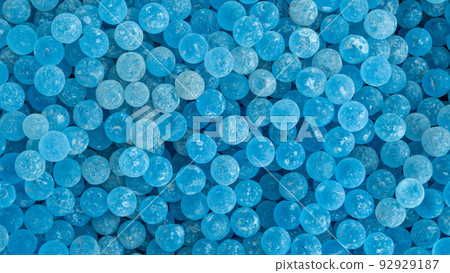 Lots of frosted blue glass ball poured into the ground for foot massage 92929187