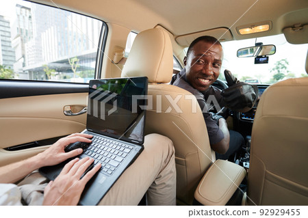 Taxi Driver Turning Back to Passenger Taxi Driver Turning Back to Passenger 92929455