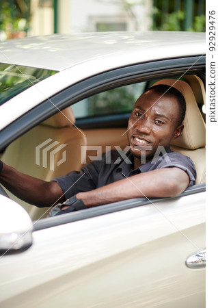 Smiling Luxury Car Driver Smiling Luxury Car Driver 92929476