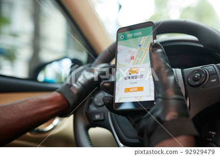 Driver Checking Car Sharing App Driver Checking Car Sharing App 92929479