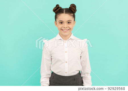 Believing in yourself. Primary school child. Girl child blue background. Basic education. 92929568