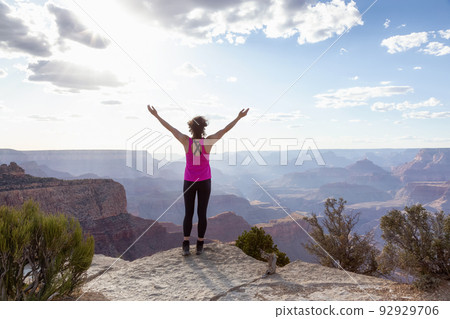 Adventurous Traveler standing on Desert Rocky Mountain American Landscape 92929706