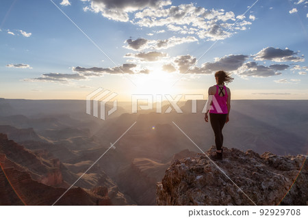 Adventurous Traveler standing on Desert Rocky Mountain American Landscape 92929708
