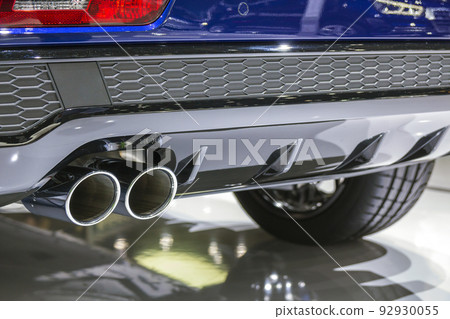 Double chrome exhaust pipe of powerful sport car with grey plastic details 92930055