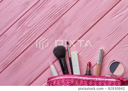 Top view pink purse with makeup tools. Brush and lipstick. Top view pink purse with makeup tools. Brush and lipstick. 92930842
