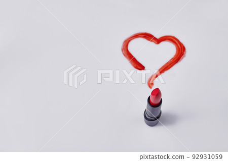 Red lipstick and drawn heart on white background. Love or valentines day concept. 92931059