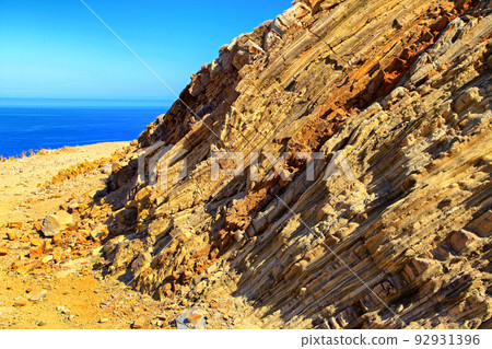 Dry mediterranean country and blue water in the sea 92931396