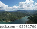 aerial shot lake and mountains, white clouds 92931790