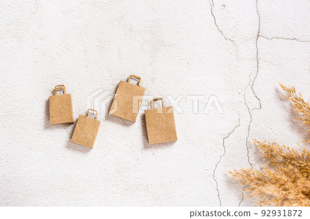 Craft paper shopping bags on a concrete background. Top view. 92931872