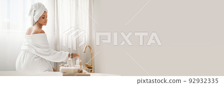 Relaxed Woman Enjoying Bodycare Rituals, Sitting In Bathroom, Copy Space Relaxed Woman Enjoying Bodycare Rituals, Sitting In Bathroom, Copy Space 92932335