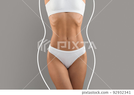 Weightloss. Slim Sporty Female Body In Underwear With Drawn Lines Around It Weightloss. Slim Sporty Female Body In Underwear With Drawn Lines Around It 92932341