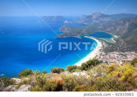 Amazing landscape of of Mediterranean coast, mountains, town Oludeniz from lycian path. Amazing landscape of of Mediterranean coast, mountains, town Oludeniz from lycian path. 92933063