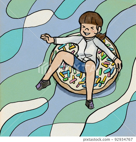 A girl playing with a floating ring A girl playing with a floating ring 92934767