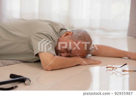 Asian senior male falling on the ground while walk with walker at home. 92935987