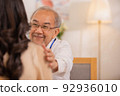 Senior Asian physician Watch as female patients discuss their health issues as you sit. 92936010
