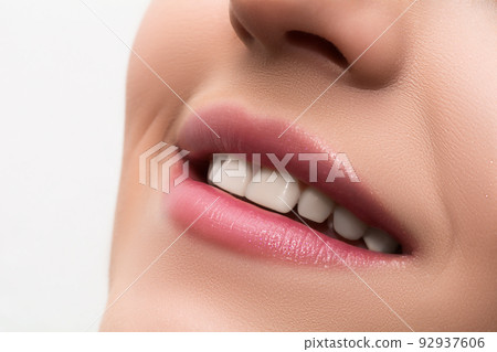 Beautiful female lips close up. Nude pink lipstick. Luxury makeup. 92937606