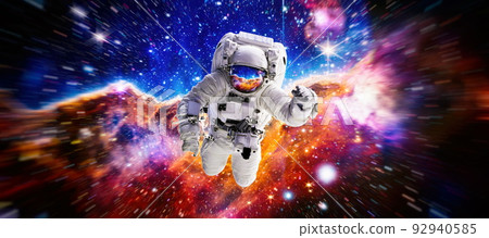 Astronaut in outer space.Cosmic art, science fiction wallpaper. Beauty of deep space. Elements of this image furnished by NASA Astronaut in outer space.Cosmic art, science fiction wallpaper. Beauty of deep space. Elements of this image furnished by NASA 92940585
