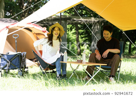 Young Japanese couple enjoying camping 92941672