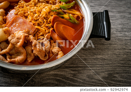 Budae Jjigae or Budaejjigae (Army stew or Army base stew). It is loaded with Kimchi, spam, sausages, ramen noodles and much more Budae Jjigae or Budaejjigae (Army stew or Army base stew). It is loaded with Kimchi, spam, sausages, ramen noodles and much more 92942974