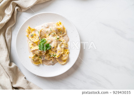 tortellini pasta with mushroom cream sauce and cheese tortellini pasta with mushroom cream sauce and cheese 92943035