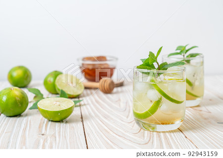 iced honey and lime soda with mint iced honey and lime soda with mint 92943159