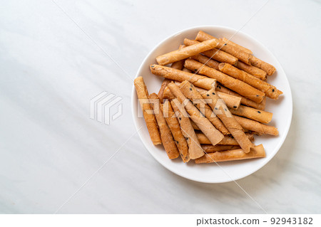 crispy coconut roll on plate crispy coconut roll on plate 92943182
