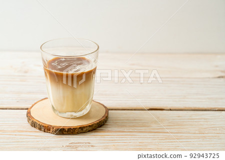 Dirty coffee, cold milk topped with hot espresso coffee shot Dirty coffee, cold milk topped with hot espresso coffee shot 92943725
