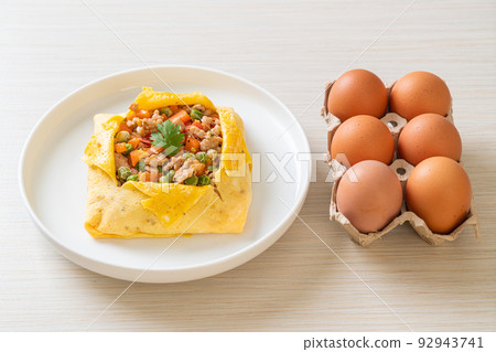 egg wrap or stuffed egg with minced pork and vegetable 92943741