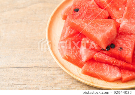 fresh watermelon sliced on plate 92944023