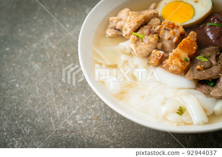 paste of rice flour or boiled Chinese pasta square in clear soup paste of rice flour or boiled Chinese pasta square in clear soup 92944037