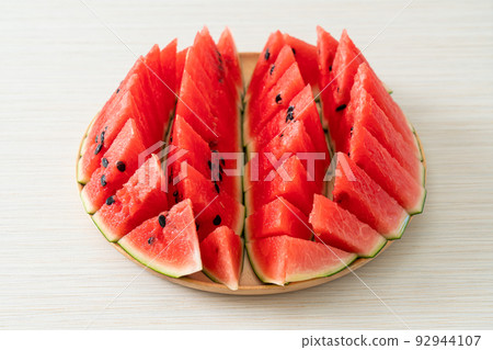 fresh watermelon sliced on plate 92944107