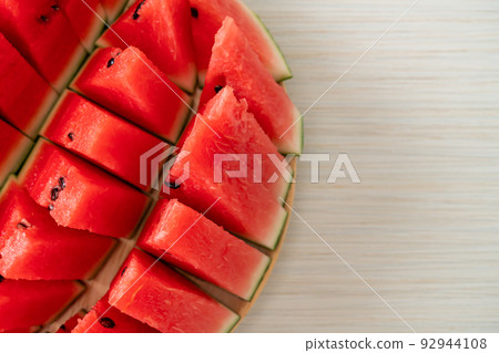 fresh watermelon sliced on plate 92944108