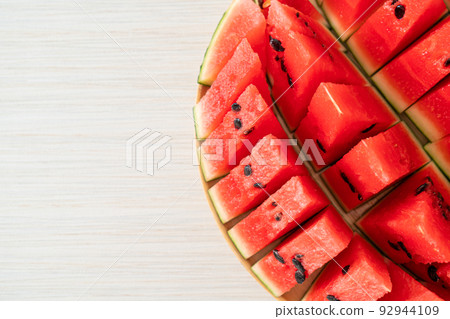fresh watermelon sliced on plate 92944109