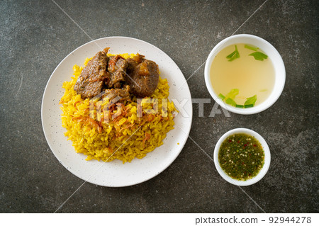 Beef Biryani or Curried rice and beef - Thai-Muslim version of Indian biryani, with fragrant yellow rice and beef 92944278