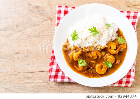 Shrimps in curry sauce on rice Shrimps in curry sauce on rice 92944374