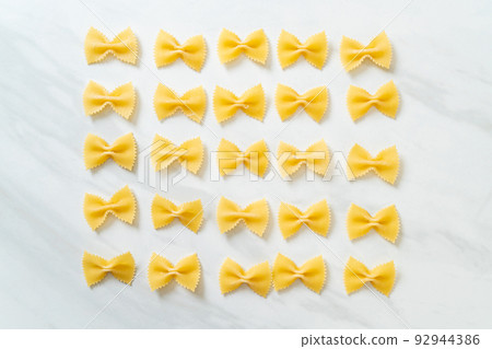 Dry uncooked farfalle pasta Dry uncooked farfalle pasta 92944386