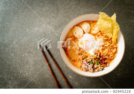 instant noodles with pork and meatballs in spicy soup 92945228