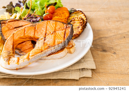 grilled salmon steak fillet with vegetable and french fries 92945241