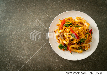 stir-fried spaghetti with salted egg and squid stir-fried spaghetti with salted egg and squid 92945306