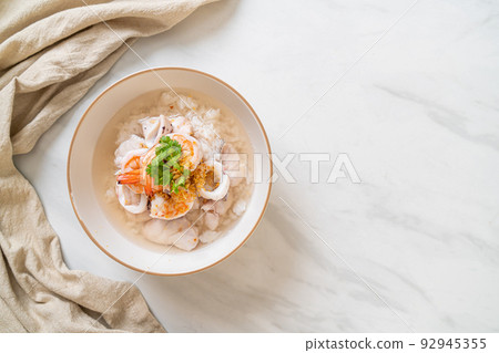 boiled rice soup with seafood 92945355