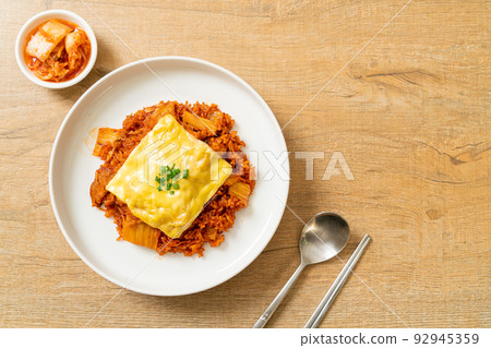kimchi fried rice with pork and topped cheese 92945359