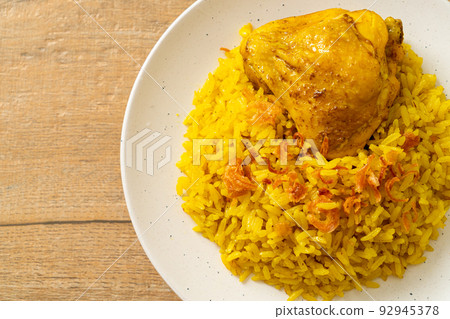 Chicken Biryani or Curried rice and chicken - Thai-Muslim version of Indian biryani, with fragrant yellow rice and chicken Chicken Biryani or Curried rice and chicken - Thai-Muslim version of Indian biryani, with fragrant yellow rice and chicken 92945378