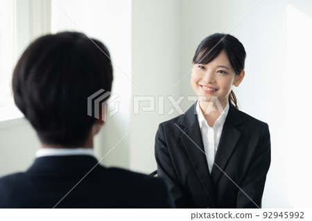 Female college student receiving an interview 92945992