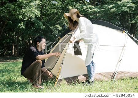 Couples, camping, outdoor leisure to set up tents 92946054
