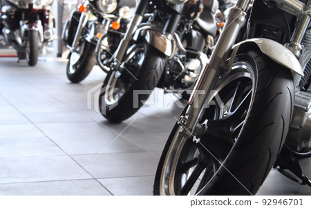 Custom chopper motorcycle in showroom of motorbike dealership store Custom chopper motorcycle in showroom of motorbike dealership store 92946701