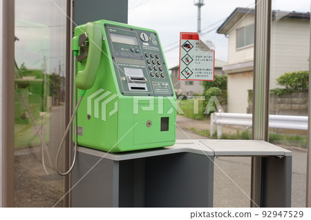 Telephone in an old telephone box in a rural town Telephone in an old telephone box in a rural town 92947529