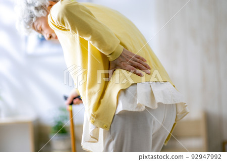 Senior woman with low back pain 92947992
