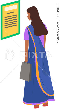 Indian girl in an ethnic costume, sari holds paper bag in her hands, stands and reads document 92949008