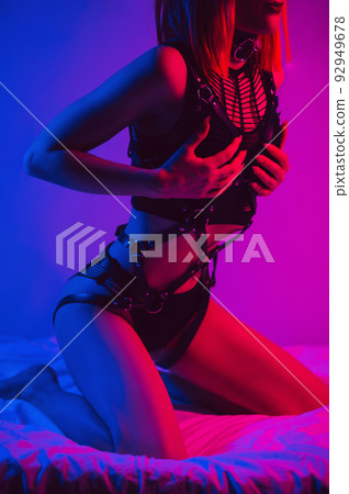 slender girl with a sexy body in erotic underwear poses beautifully on a bed in a bedroom slender girl with a sexy body in erotic underwear poses beautifully on a bed in a bedroom 92949678